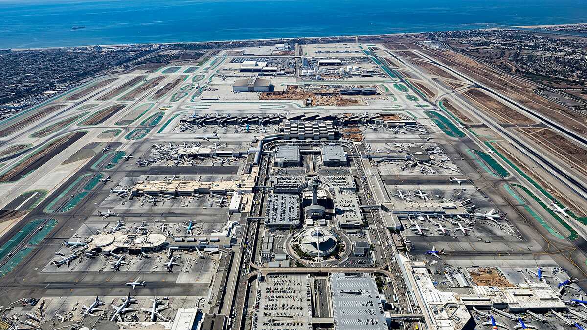 Aerial view of LAX terminals, runways, and parked aircraft