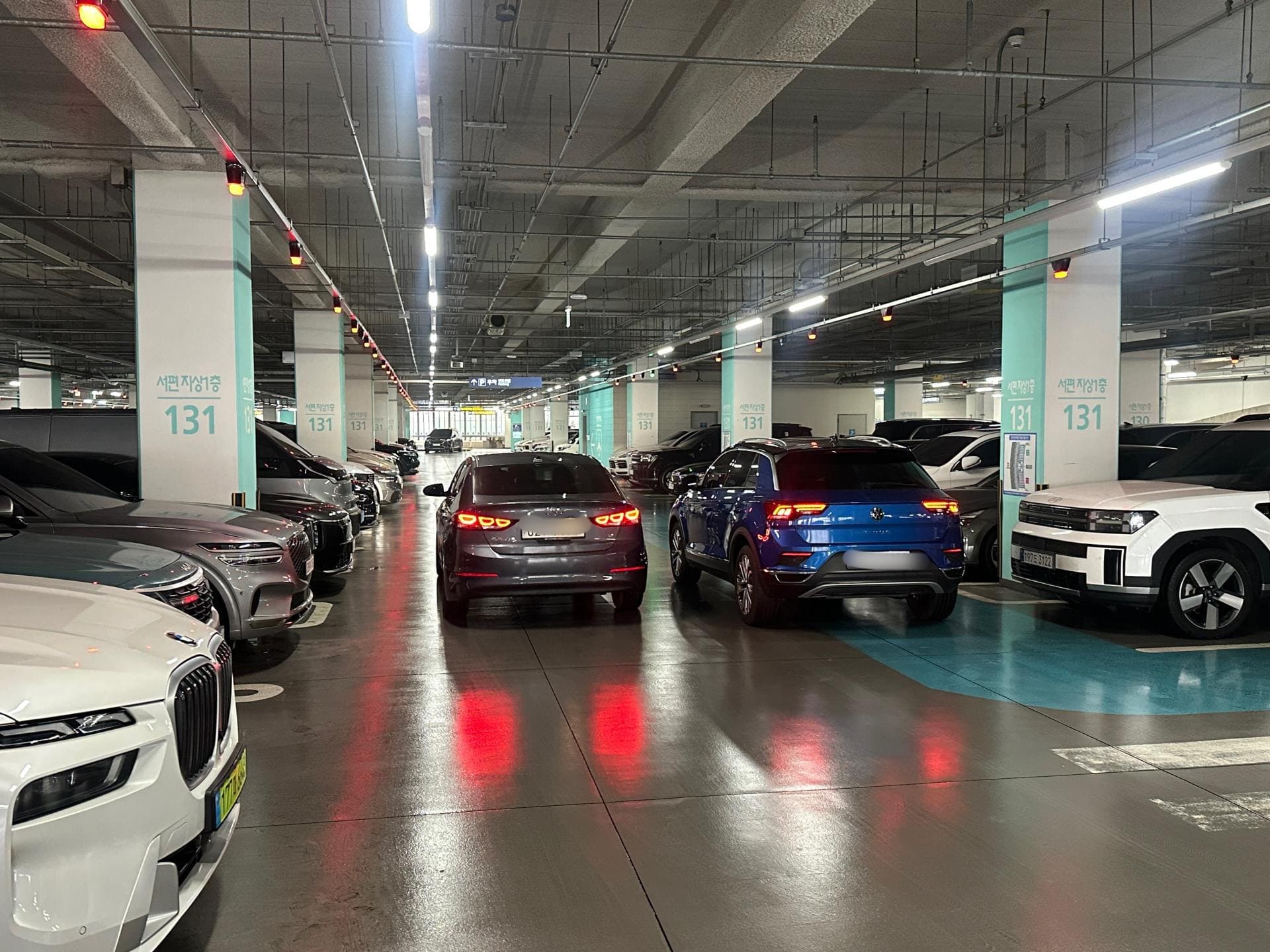 Covered airport parking garage with high vehicle occupancy near LAX