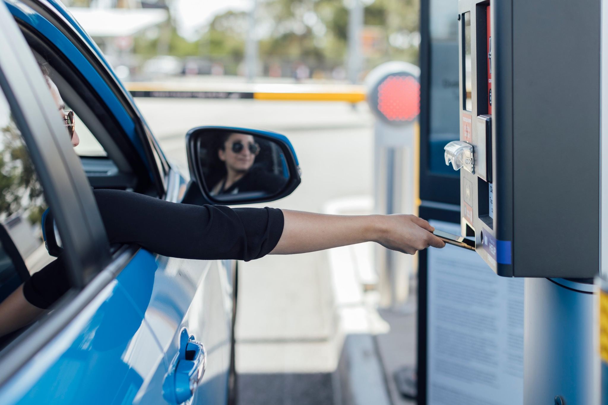 Driver paying at a parking exit gate near LAX