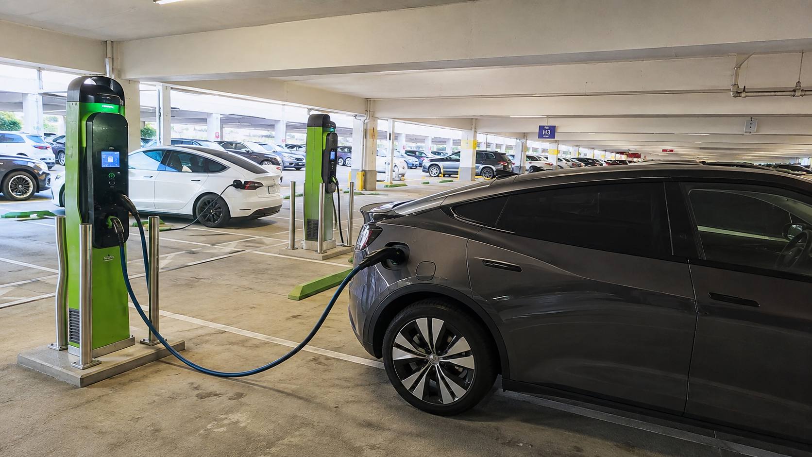 EV charging stations inside a covered parking garage near LAX
