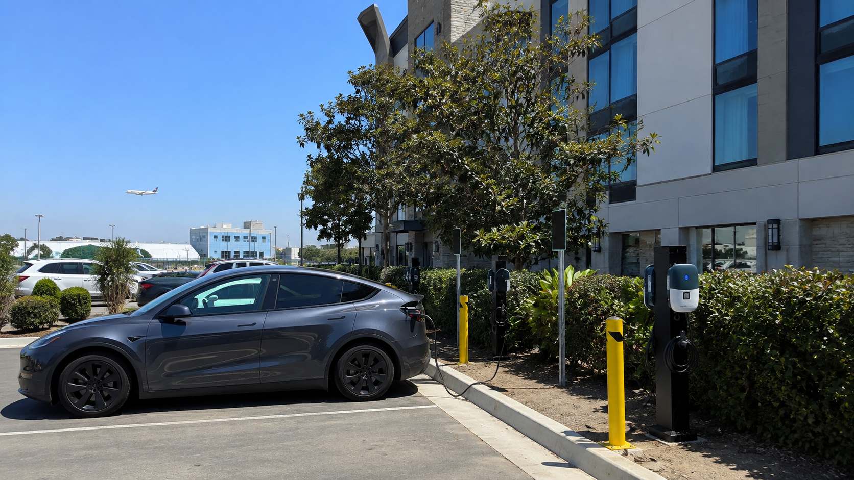 Electric vehicle charging at a hotel parking lot near LAX