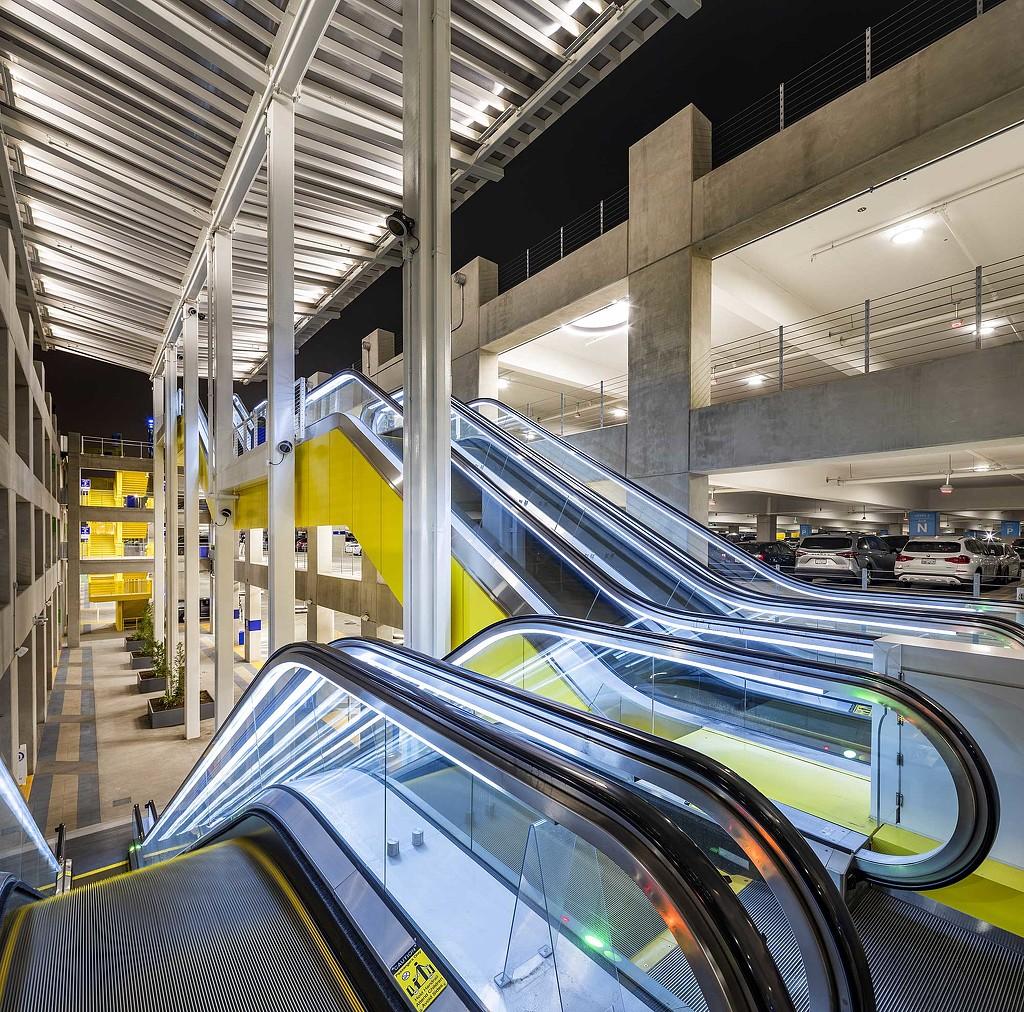 covered airport parking garage interior with lighting